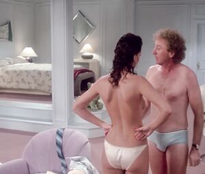 Kelly LeBrock nude - The Woman in Red (1984)